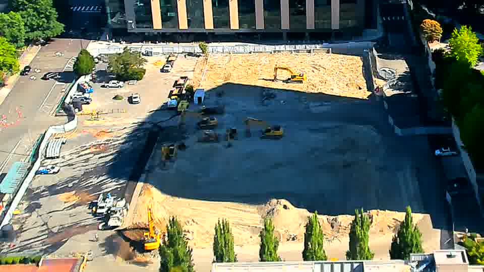 The work area continues to show a consistent state, with no apparent shifts in equipment locations or material piles.