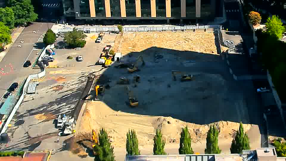 The equipment remains in generally the same positions, though one of the excavators near the center of the frame seems to have shifted slightly to the south.