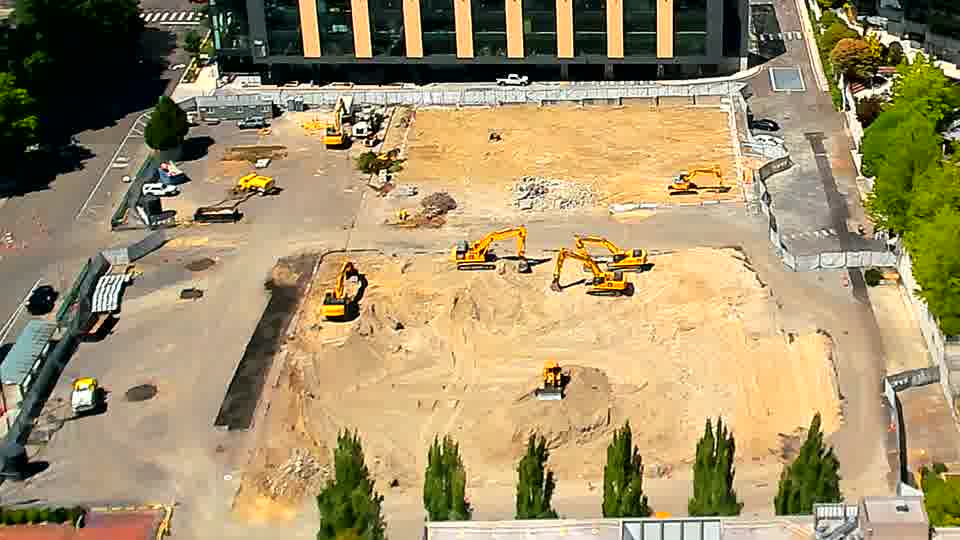 The arrangement of equipment remains consistent, though a small yellow machine has shifted position slightly in the foreground.
