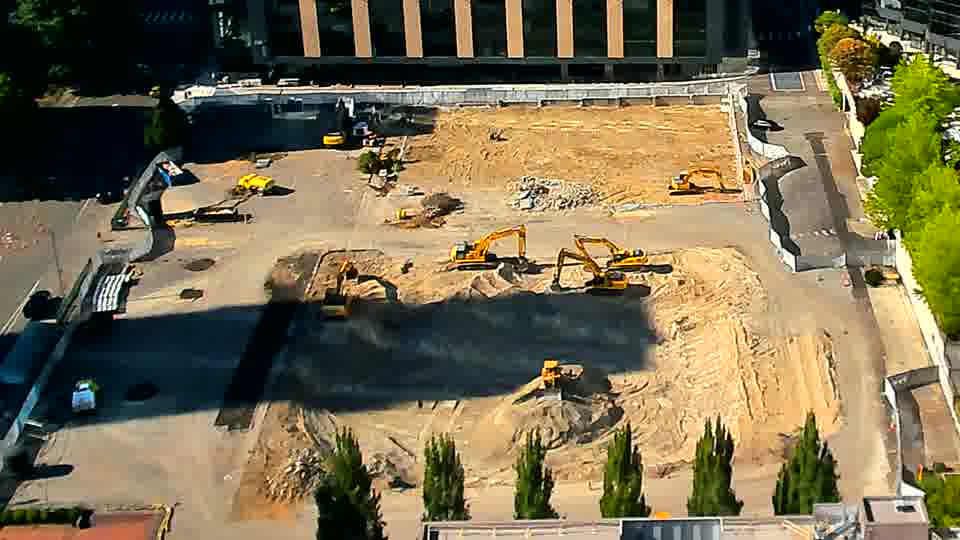 A blue pickup truck is now positioned near the driveway on the left side of the frame.