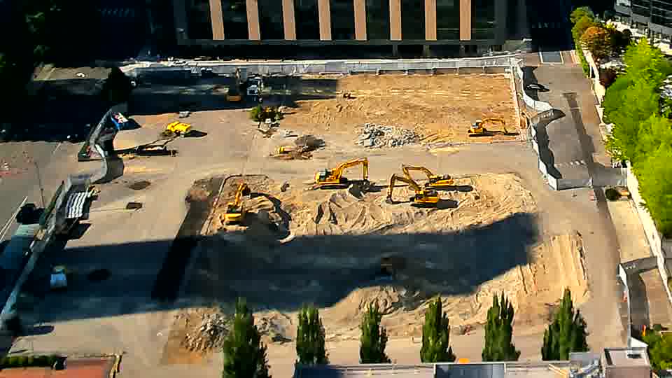 The overall arrangement of equipment and materials holds steady, though the shadows have shifted slightly with the sun’s movement.