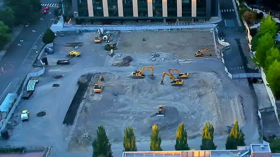 The overall view of the site is consistent, showing no significant shifts in equipment placement or material distribution.
