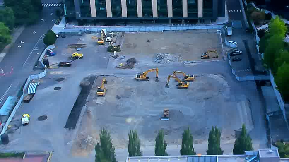The heavy equipment appears to be standing still, with no discernible changes in placement over the past fifteen minutes.