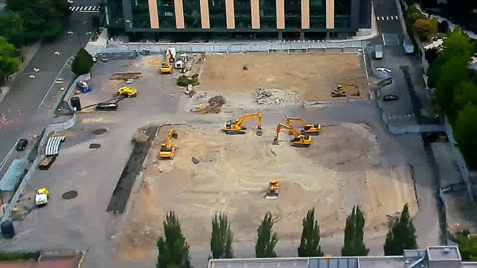 The arrangement of equipment on site appears consistent between these views, showing no discernible shifts in position.