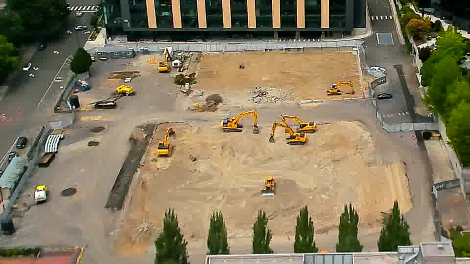 The scene appears quite similar, with the equipment maintaining its general distribution across the site.
