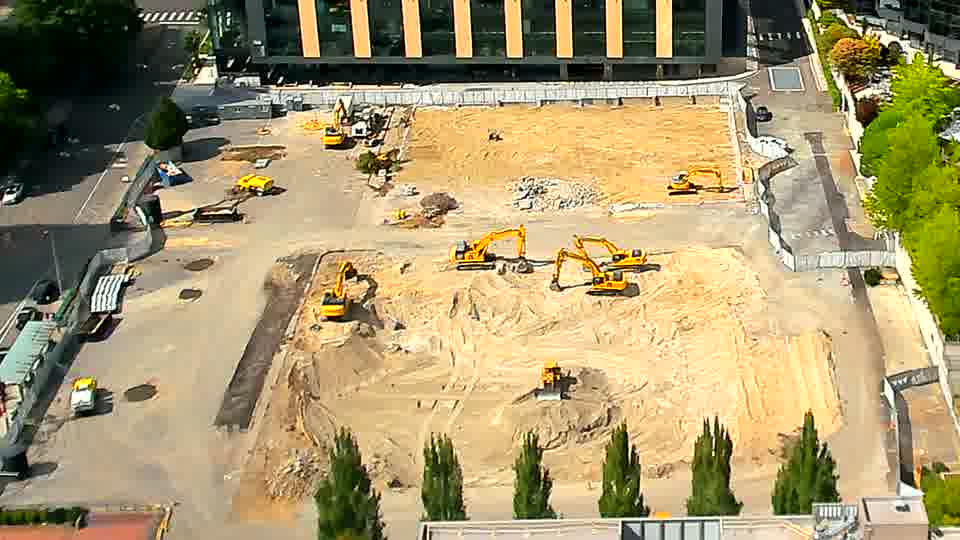 The arrangement of machinery appears stable, with only minor variations in the positioning of one of the excavators near the center.