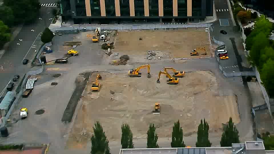 The site appears much the same as it did a few moments ago, with the equipment largely unmoved.