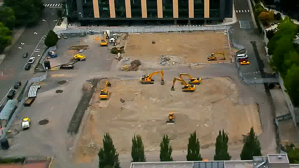 The arrangement of equipment on site remains largely consistent between these views.