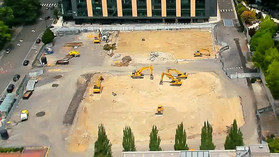 The heavy machinery remains in essentially the same arrangement as before, with no obvious movement detected.