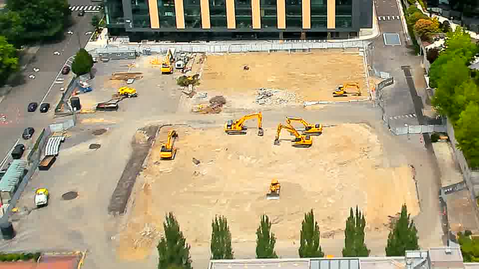 The scene appears much the same as it did moments ago, with the equipment maintaining its positions across the site.
