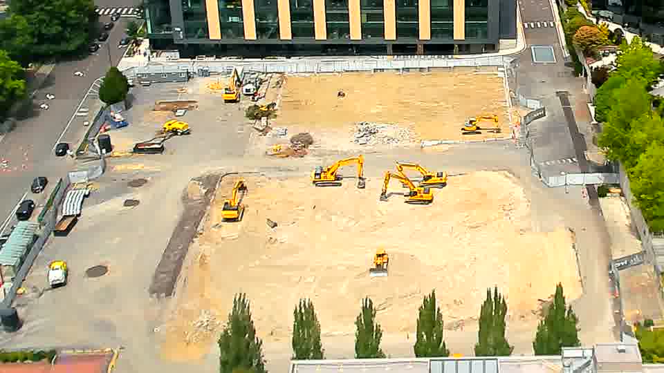 The arrangement of equipment across the site remains consistent, with no apparent repositioning in the last quarter hour.