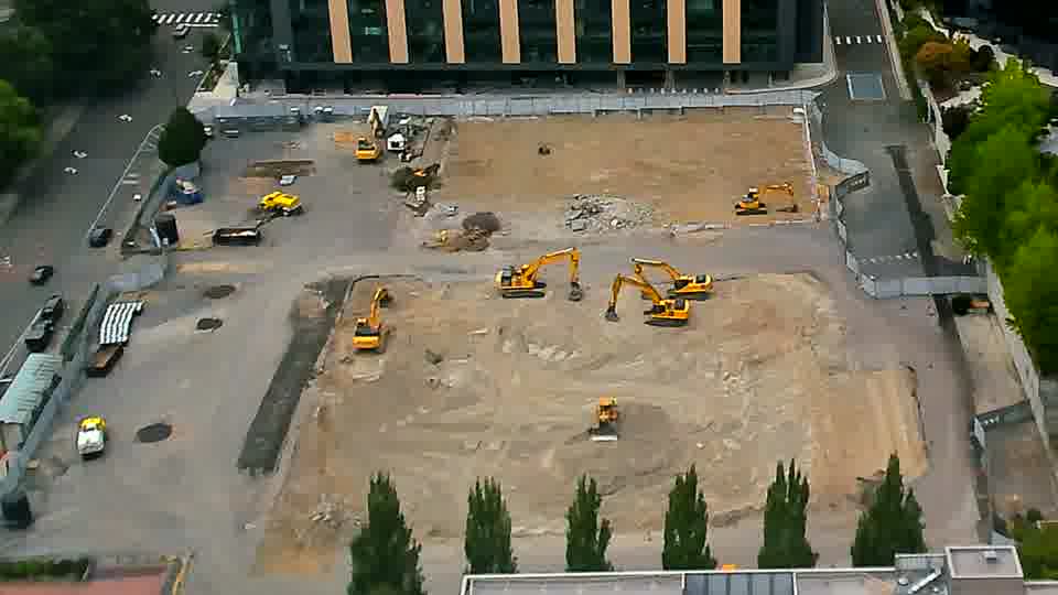 The arrangement of equipment across the site appears static, with no discernible shifts in position over the last quarter hour.