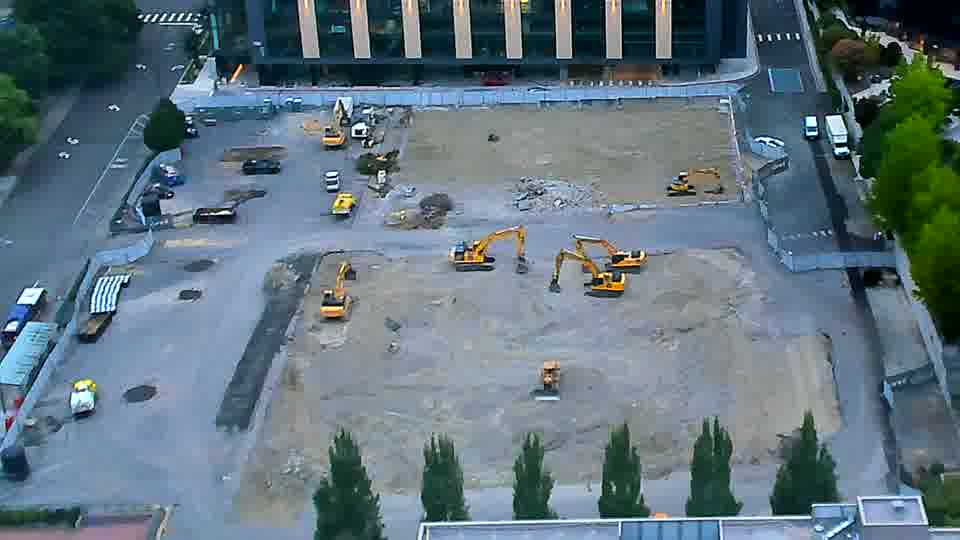 The arrangement of equipment across the site remains consistent, with no apparent shifts in position over the last fifteen minutes.