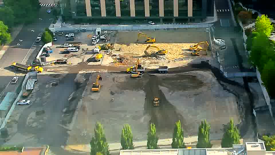 The equipment arrangement appears quite stable, though a small, dark-colored machine has shifted position in the lower-right quadrant of the site.