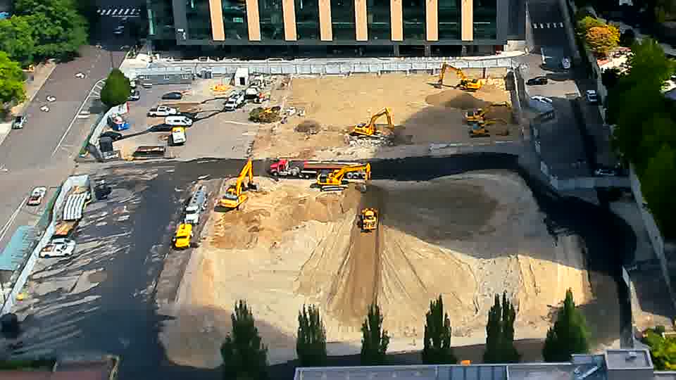 One of the excavators near the center of the site is now facing in a different direction.