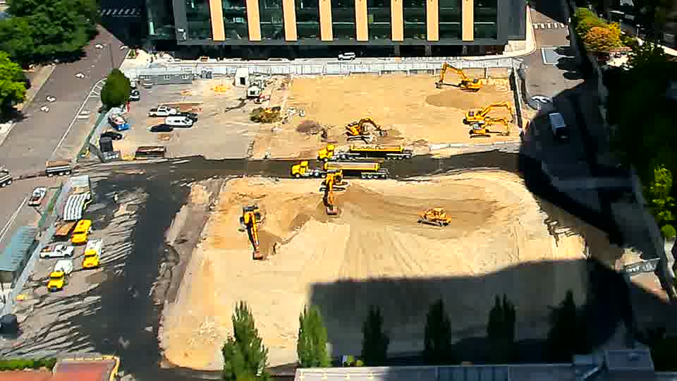 The machines on site appear largely static, with only minor changes in shadow patterns over the last quarter hour.