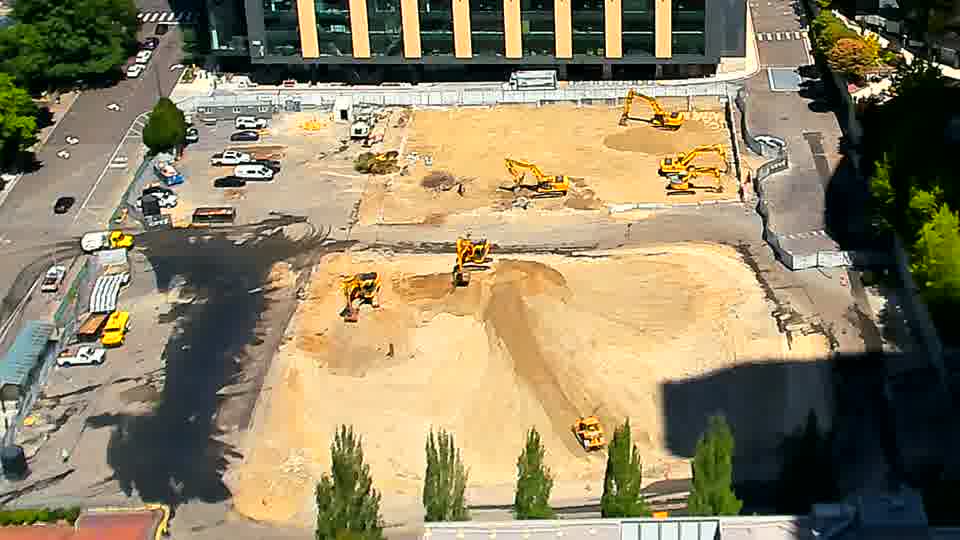 The scene remains largely as it was, with the equipment holding its positions across the work area.