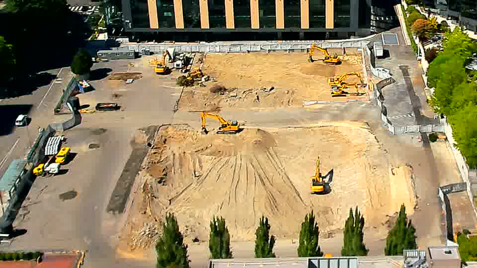 The equipment on the site remains in mostly the same positions, with no obvious shifts in location or activity.