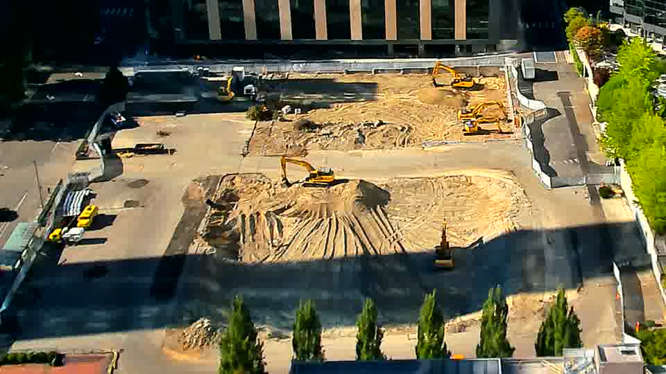 A small piece of heavy machinery has shifted position in the lower center of the frame.