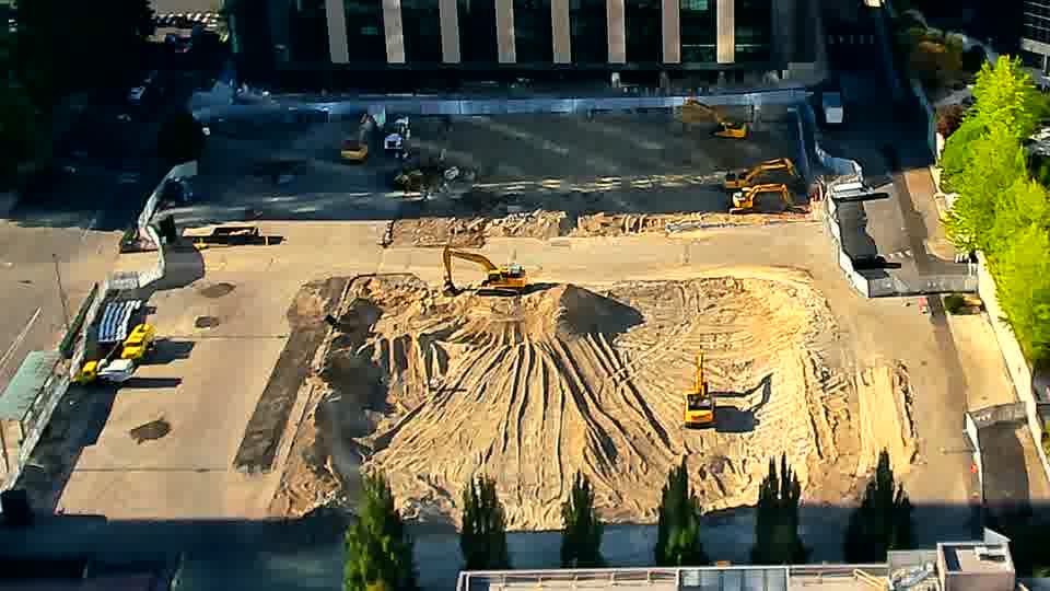 The overall scene appears static, with the machinery maintaining its placement across the work area.