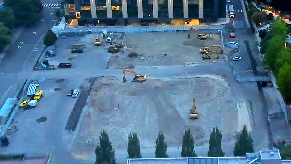 The site remains quiet, with the arrangement of heavy machinery appearing consistent between these views.