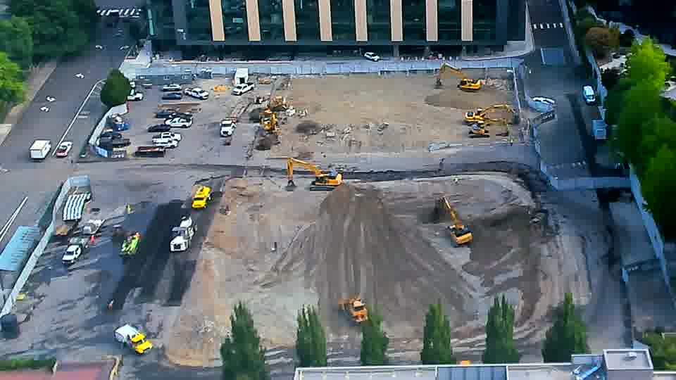 The work area remains quite still, with the machines holding their positions from the previous view.