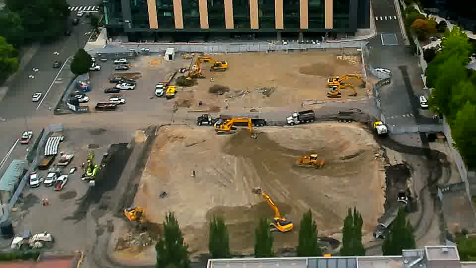 The scene is remarkably still, with no obvious shifts in the locations of equipment or any vehicle traffic.