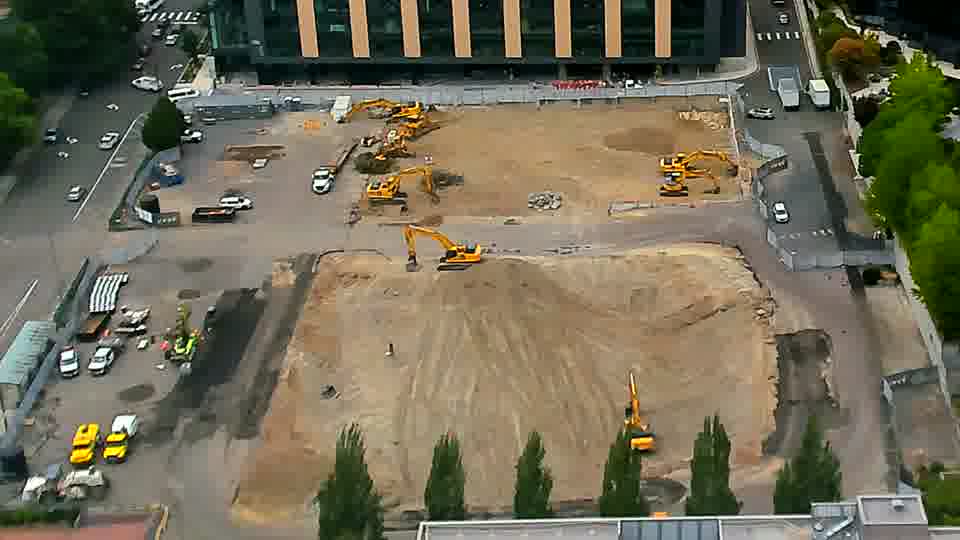 The construction site maintains a consistent appearance, with no apparent shifts in the location of equipment or any arriving vehicles.