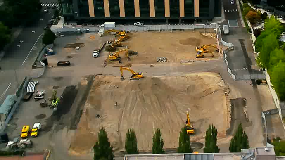 The site's layout is consistent between frames, with no visible movement of equipment or incoming traffic.