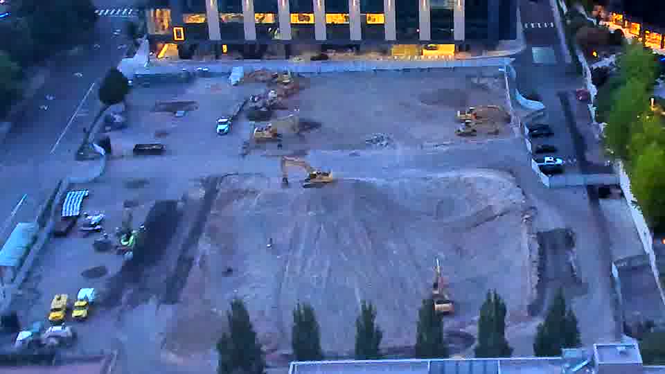 The scene appears largely unchanged, with the machines and materials remaining in similar locations.