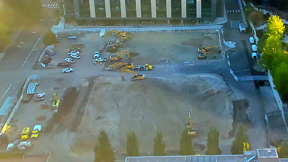 The scene remains remarkably consistent, with the machinery holding steady in its positions across the site.