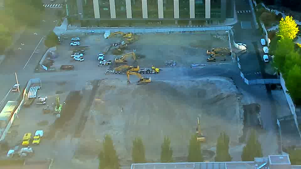 The equipment arrangement across the site holds its earlier pattern, with no visible shifts in position over the last quarter hour.