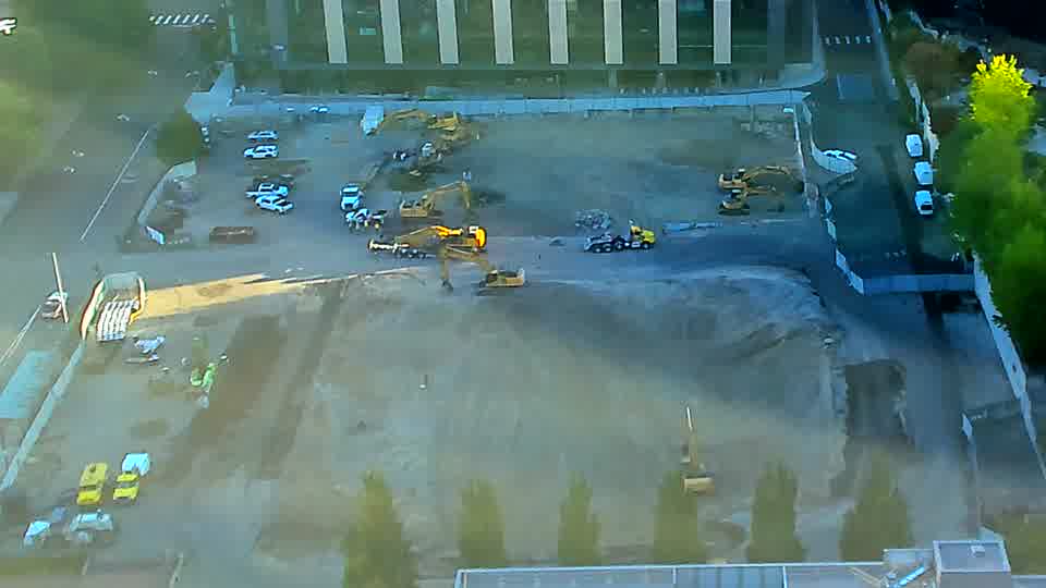 The machinery across the site maintains its earlier positions, showing no discernible shifts in the last fifteen minutes.