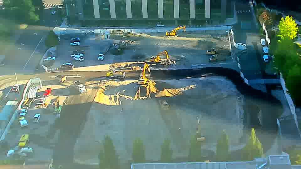 The large work area appears unchanged, with the machines maintaining their positions from the previous view.