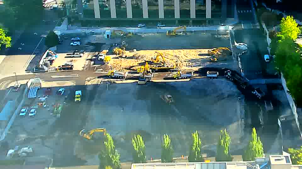 The scene remains remarkably consistent, with the machines all holding their earlier positions across the work area.