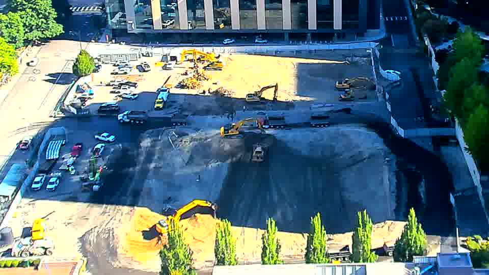 The site appears much the same as before, with the machines maintaining their general locations within the work area.