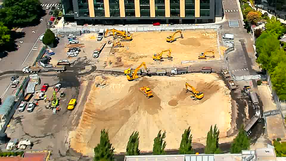 The heavy machinery maintains its current layout, with no apparent shifts in position during the last fifteen minutes.