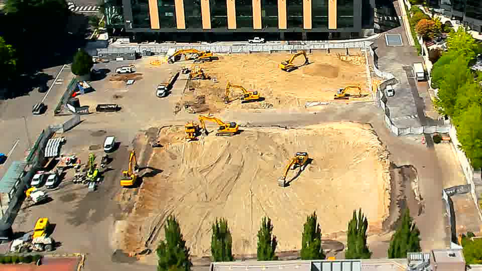 The overall layout of the site remains stable, with no readily apparent shifts in the positions of the larger machines.