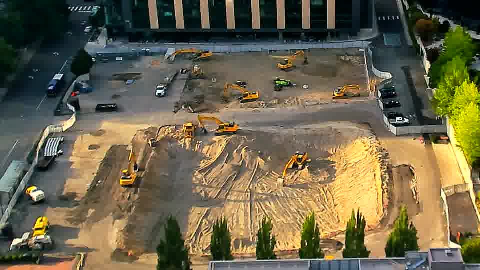 The overall scene holds steady, with equipment and material arrangements appearing consistent between views.