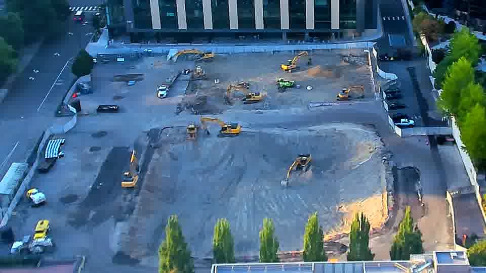 The scene remains remarkably still, with no discernible shifts in machine placement or material distribution.