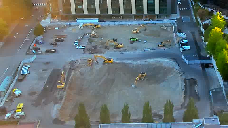 The equipment across the site appears to be holding its positions, with no discernible shifts in placement during the last fifteen minutes.