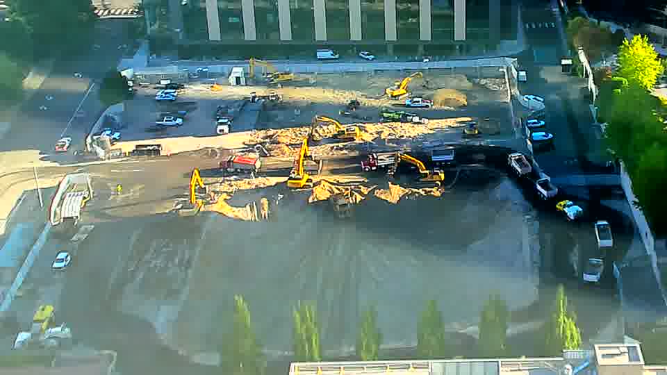 The site holds a steady appearance, with no apparent movement of equipment or vehicles in the last fifteen minutes.