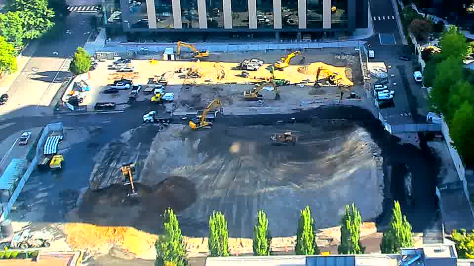 A white van has entered the site from the driveway on the left and is now positioned near the center.