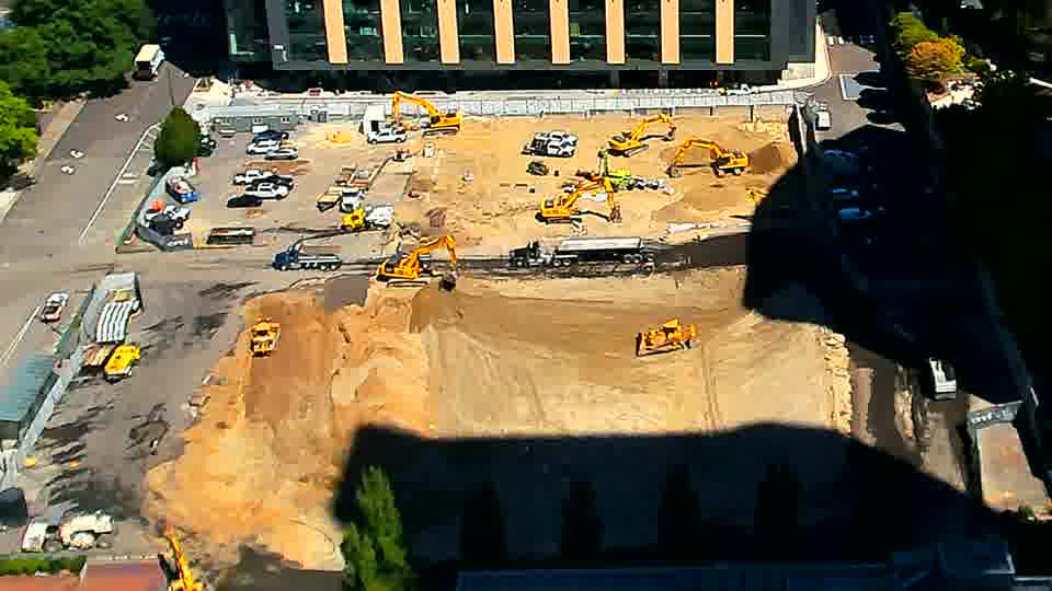 The site presents a largely static view, with equipment remaining in the same general locations as before.
