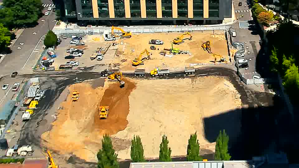 The site appears largely unchanged, though sunlight has shifted slightly across the graded area.