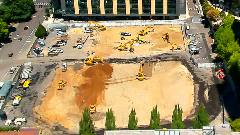 Equipment positions across the site look consistent, with no observable shifts in machinery or material placement.