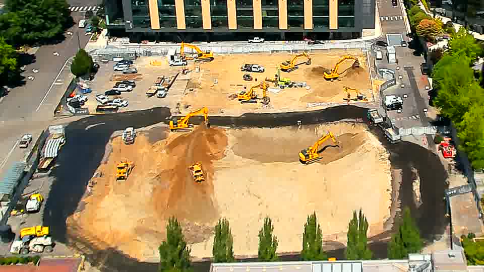 The arrangement of machinery across the site holds steady, with no noticeable changes in position over the last quarter hour.