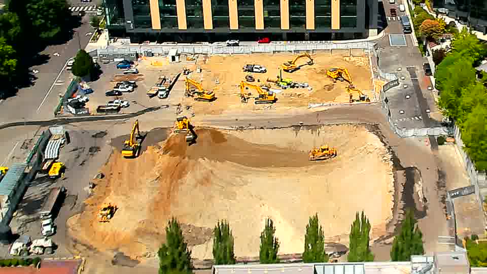 The equipment layout appears largely unchanged, though one smaller machine near the center of the site has turned slightly.