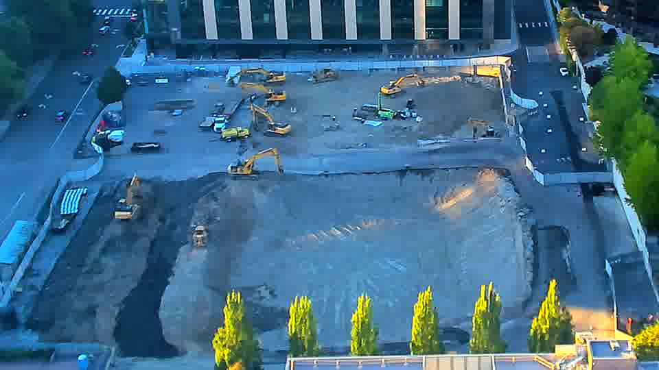 The arrangement of equipment on site seems to have held steady, though the shadows have shifted with the sun.