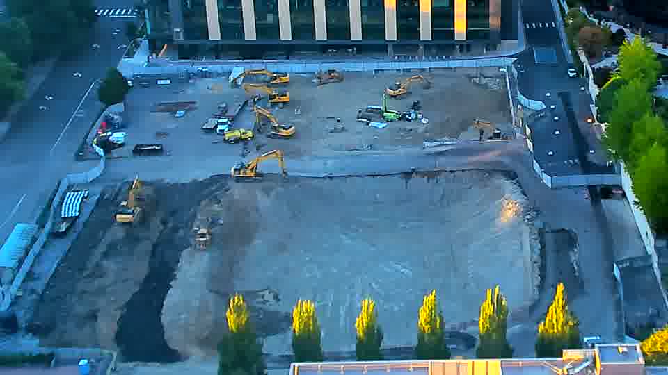 The scene appears largely static, with the machines and materials remaining in their previous locations.